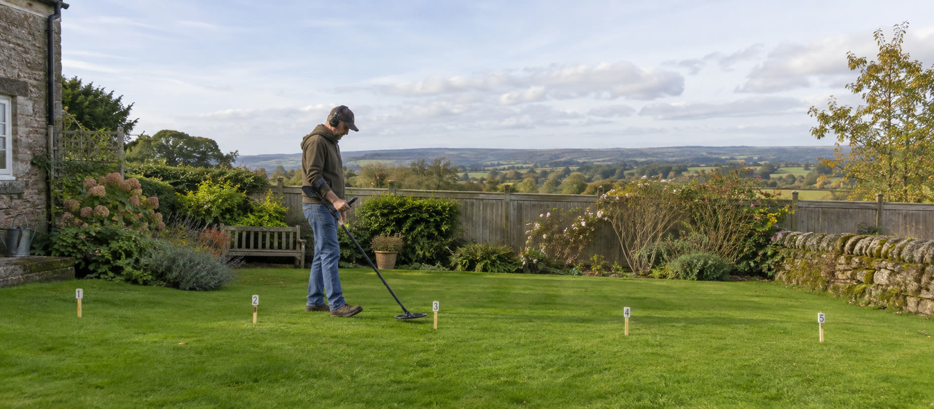 Detectorist practising over a marked test lane in a modest British garden